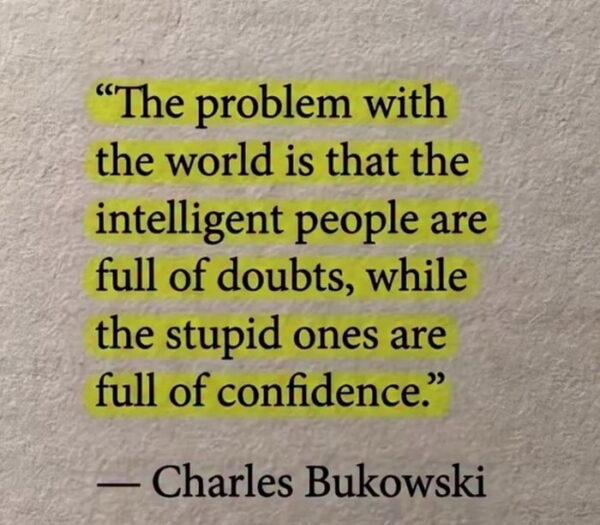 Printed Charles Bukowski quote highlighted in yellow: "The problem with the world is that the intelligent people are full of doubts, while the stupid ones are full of confidence."